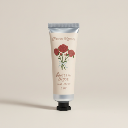 Hand cream tube labeled 'English Rose' with floral design on a white background