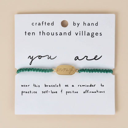 Adjustable green macrame bracelet with brass charm engraved "You Are Enough"