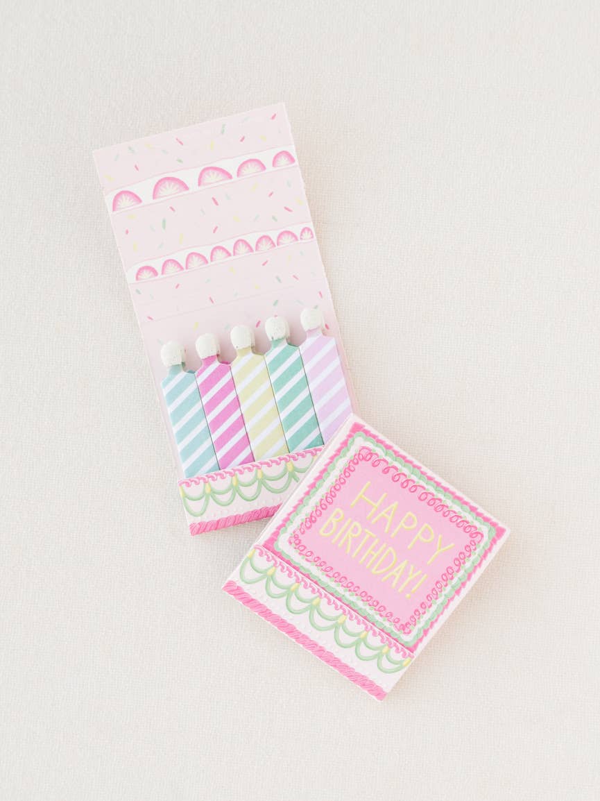 Close up of the vintage cake and candle matchbook open and showing the front that says, "Happy Birthday"