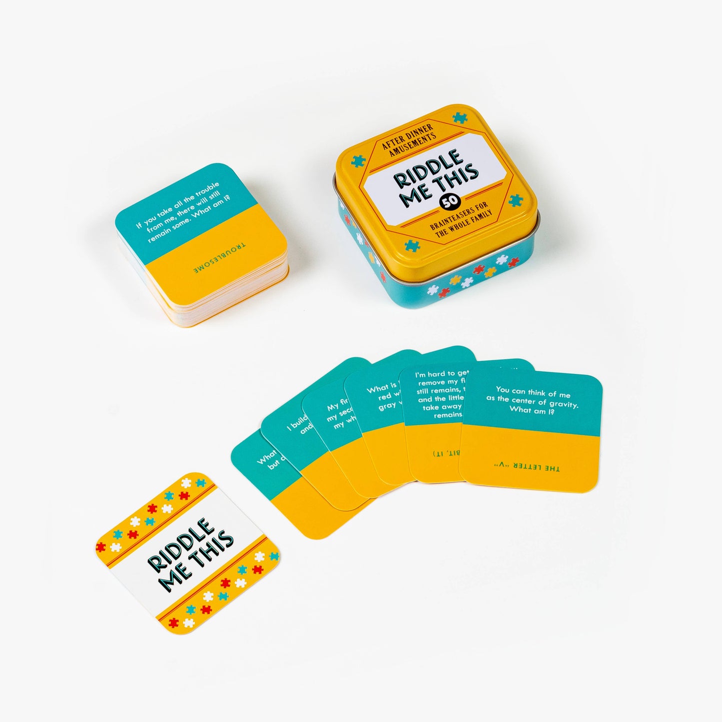 Riddle Me This game set with cards and tin container on a white background