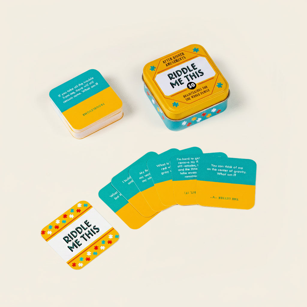 Riddle Me This game set with cards and tin container on a white background