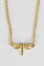Close-up of brass dragonfly pendant on 15-inch chain, handcrafted by artisans