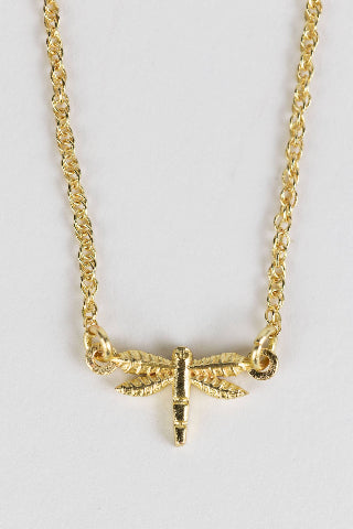 Close-up of brass dragonfly pendant on 15-inch chain, handcrafted by artisans