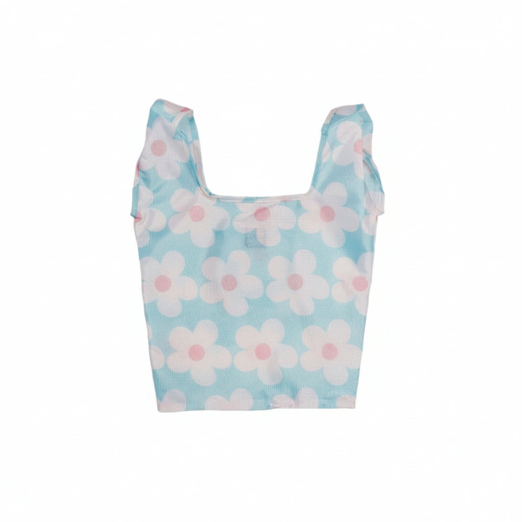 Compact tote bag with a pattern of white daisies on a light blue background.