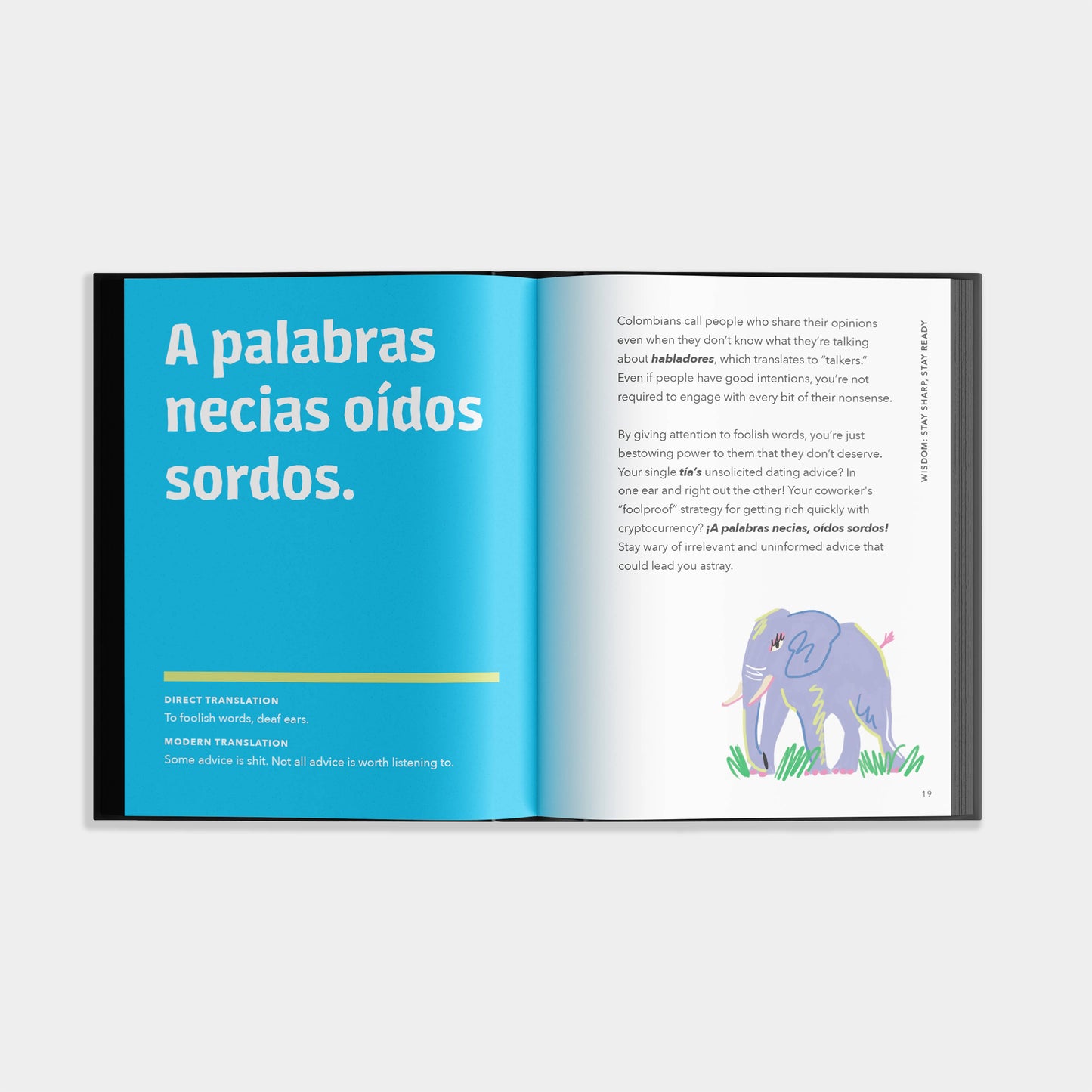 Open book with text and an illustration of an elephant on a white background