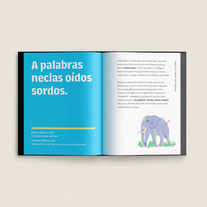 Open book with text and an illustration of an elephant on a white background
