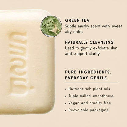 Bar of soap with green tea label and product details on a white background