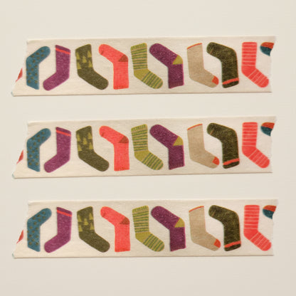 Close up view of three strips of the playful and fun stockings or socks on washi tape 