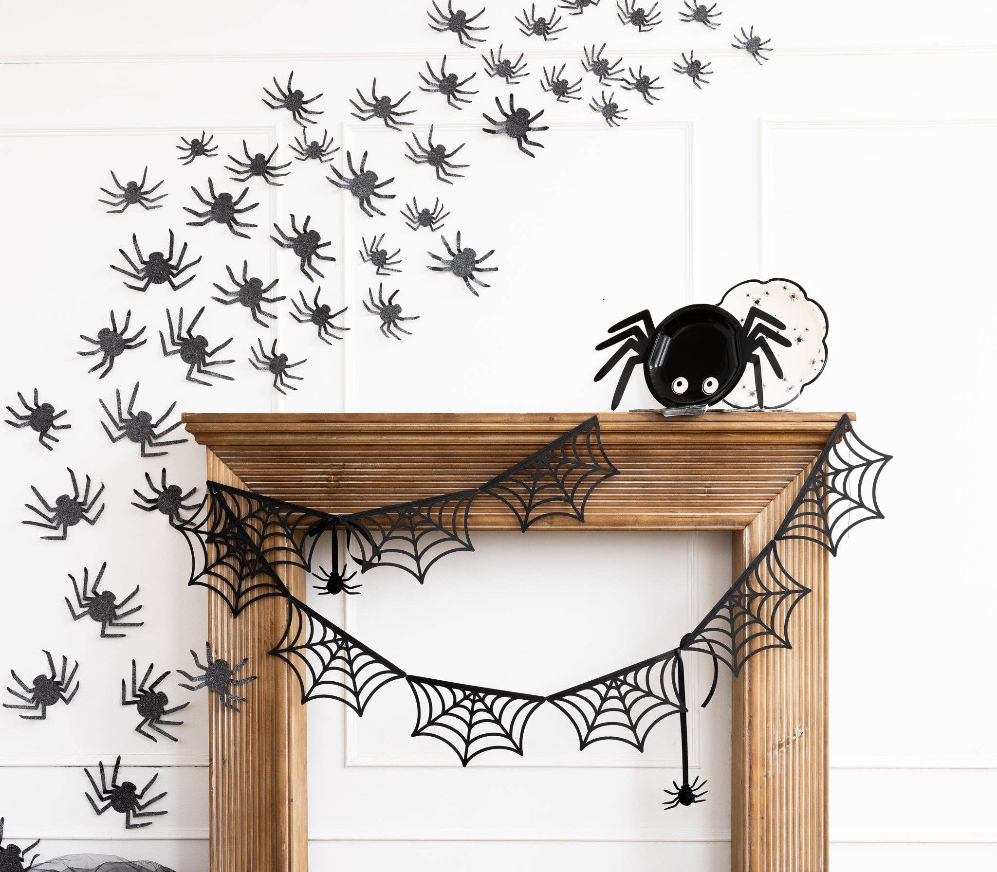 to 4 images)
Full view of Spider Web Bunting Banner hanging with paper fans and spiders