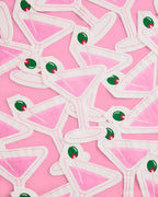 "Extra Dirty" martini-themed paper napkins with a printed pink martini glass and green olive, perfect for cocktails, birthdays, and celebrations.