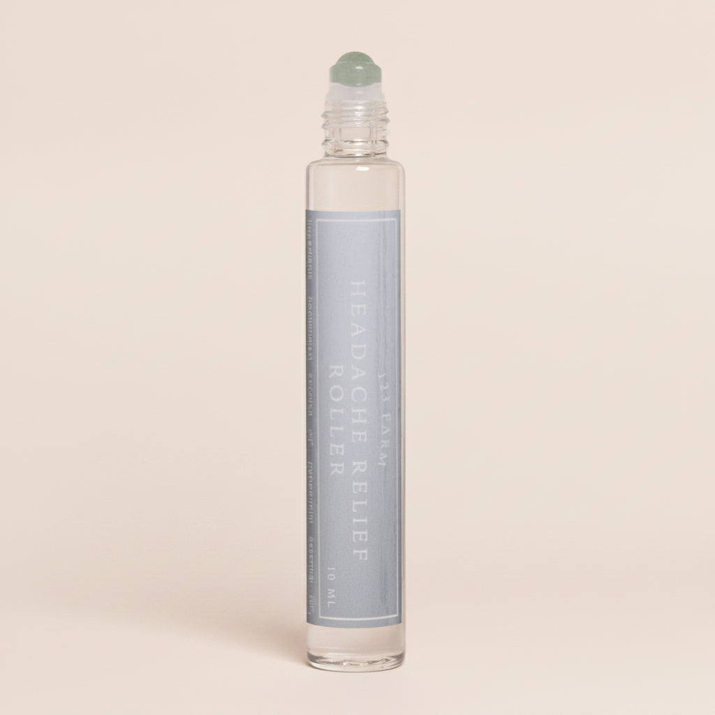 Roll-on bottle with a white cap on a white background