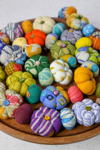 Flat lay of the full 6-foot garland, showing colorful bead and pumpkin details