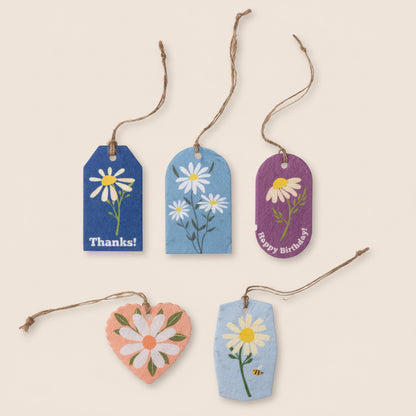 Set of decorative gift tags with Daisy designs and text on a white background