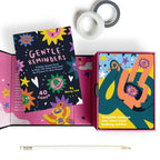 Colorful card deck with 'Gentle Reminders' and 'Daily Oracle Deck' text, featuring abstract designs.