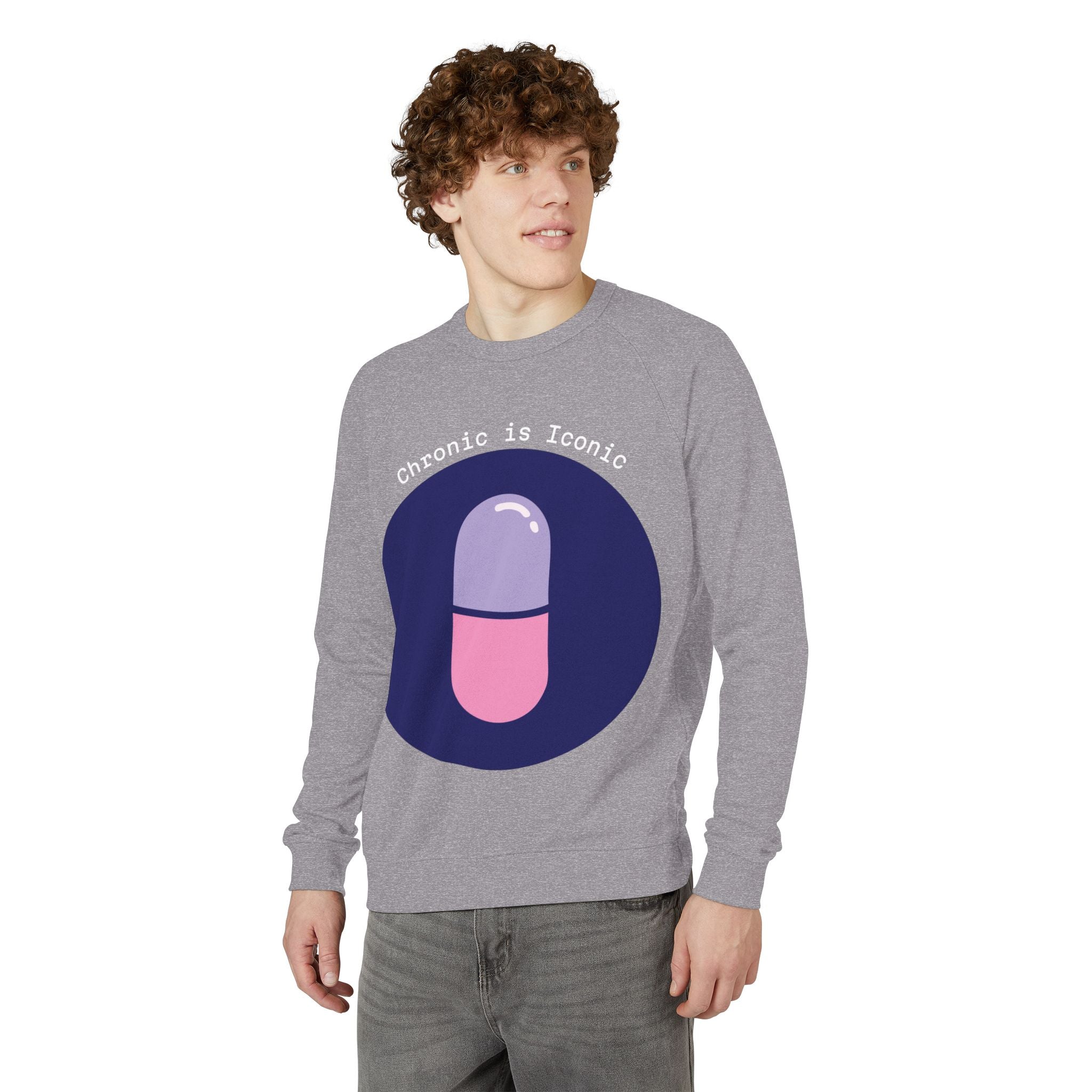 Person wearing a gray sweatshirt with a colorful pill graphic and text on a white background