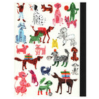 Close up view of the back cover of the composition book showcasing the details and variety of dogs