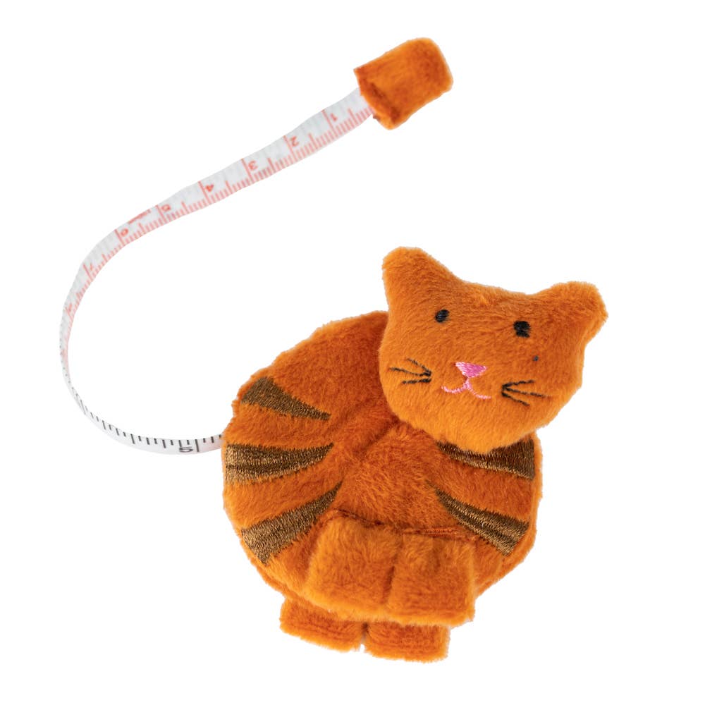 An orange fabric cat tape measurer on a white background