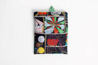Eco-friendly Bodega Art Sack® folding into a compact pouch the size of 4.5 x 5.75 inches for easy storage and portability.