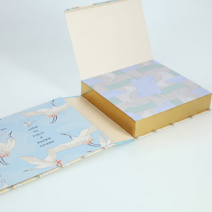 Open book with bird illustrations on a white background