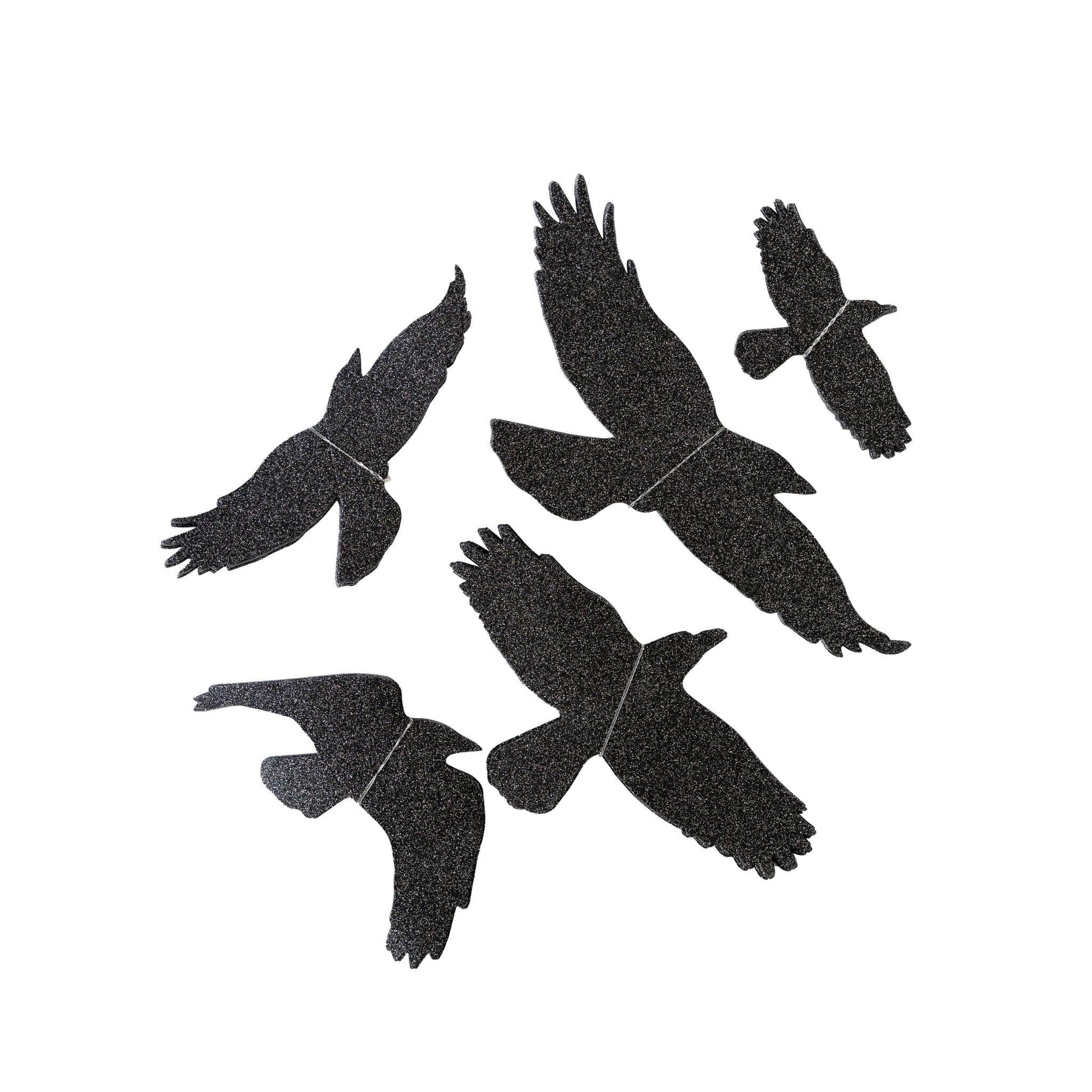 Black silhouette of six birds on a white background