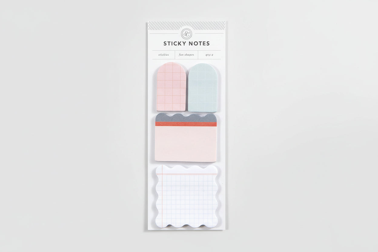 Pack of sticky notes with pink, blue, and white designs on a white background