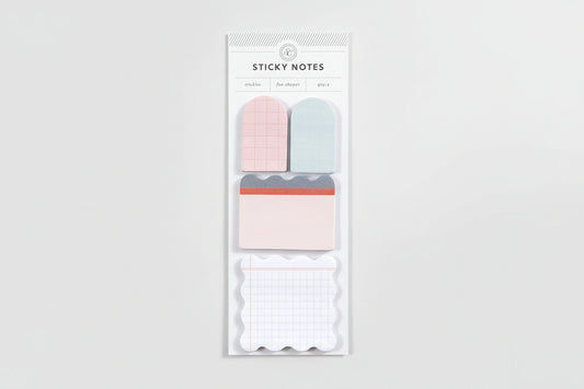 Pack of sticky notes with pink, blue, and white designs on a white background