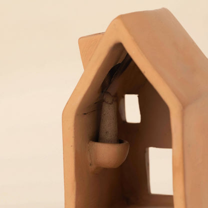 Detailed view of where the cone of incense sits on the back of the incense holder 