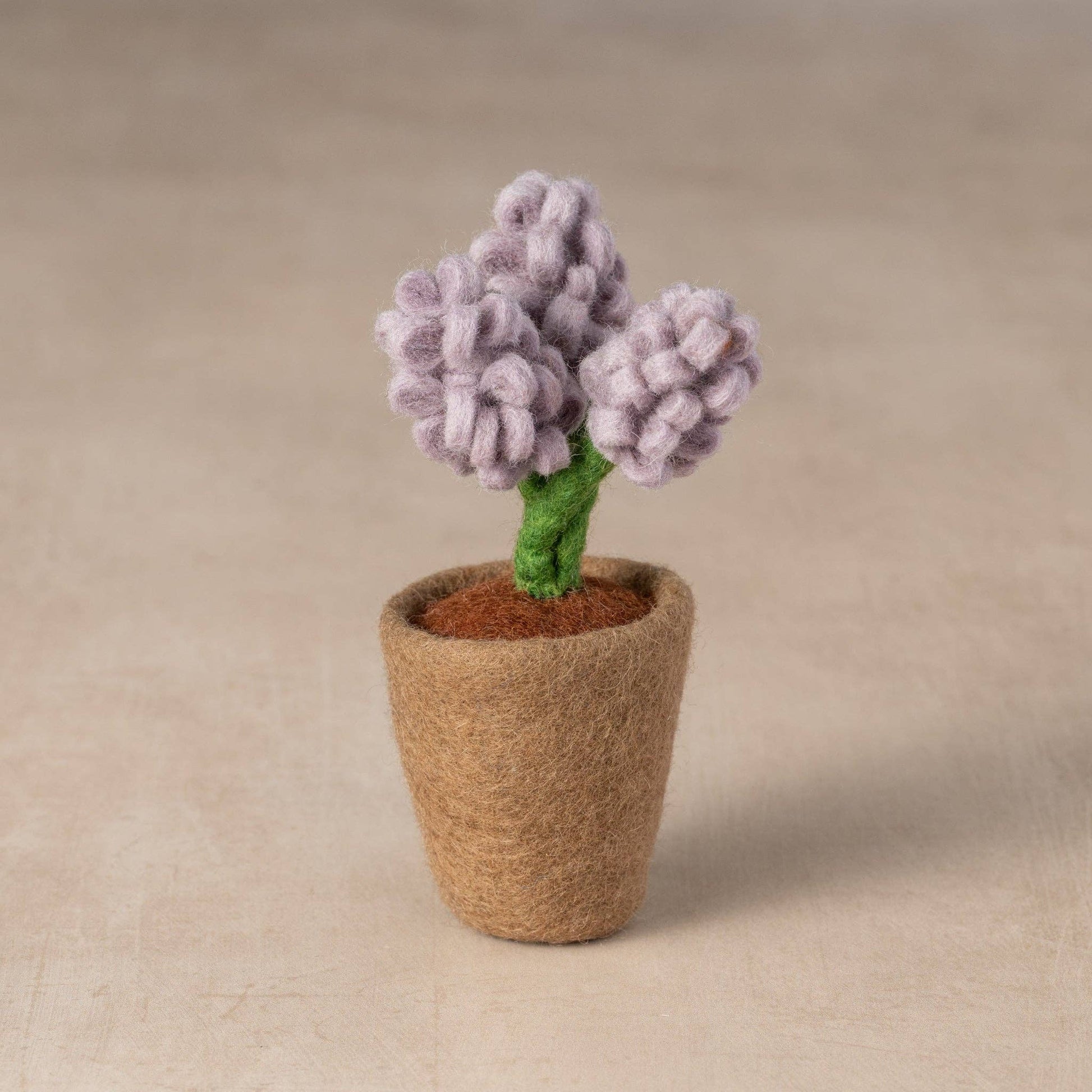 Felted lavender hyacinth flower pot with three wool stems in a soft brown base