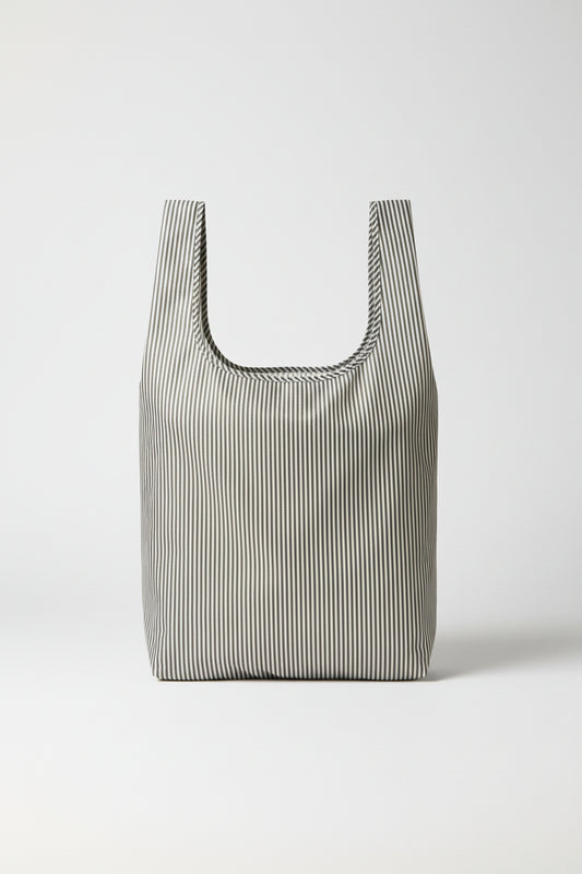 Black and white striped reusable tote bag, BRNG Vickie Daily Shopper unfolded and open on a white background.