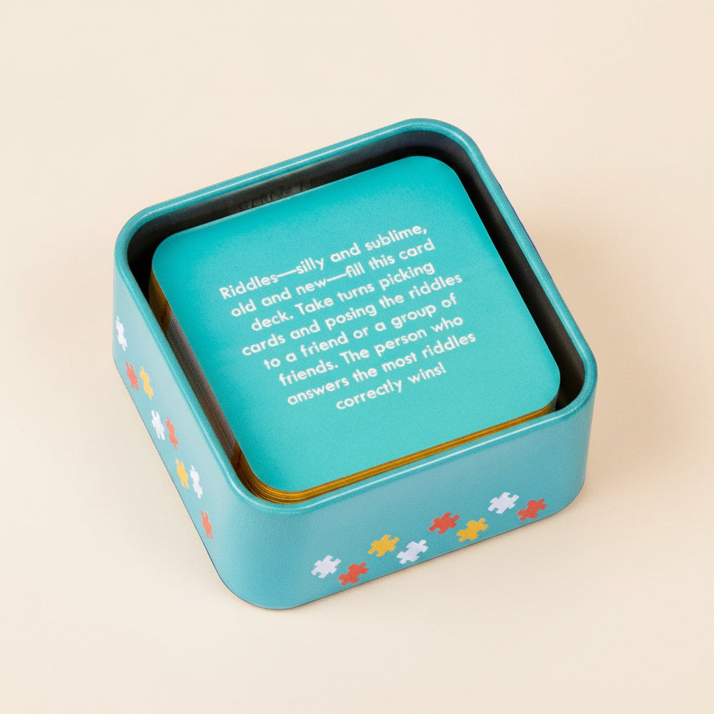 Blue card game box with puzzle piece designs on a white background