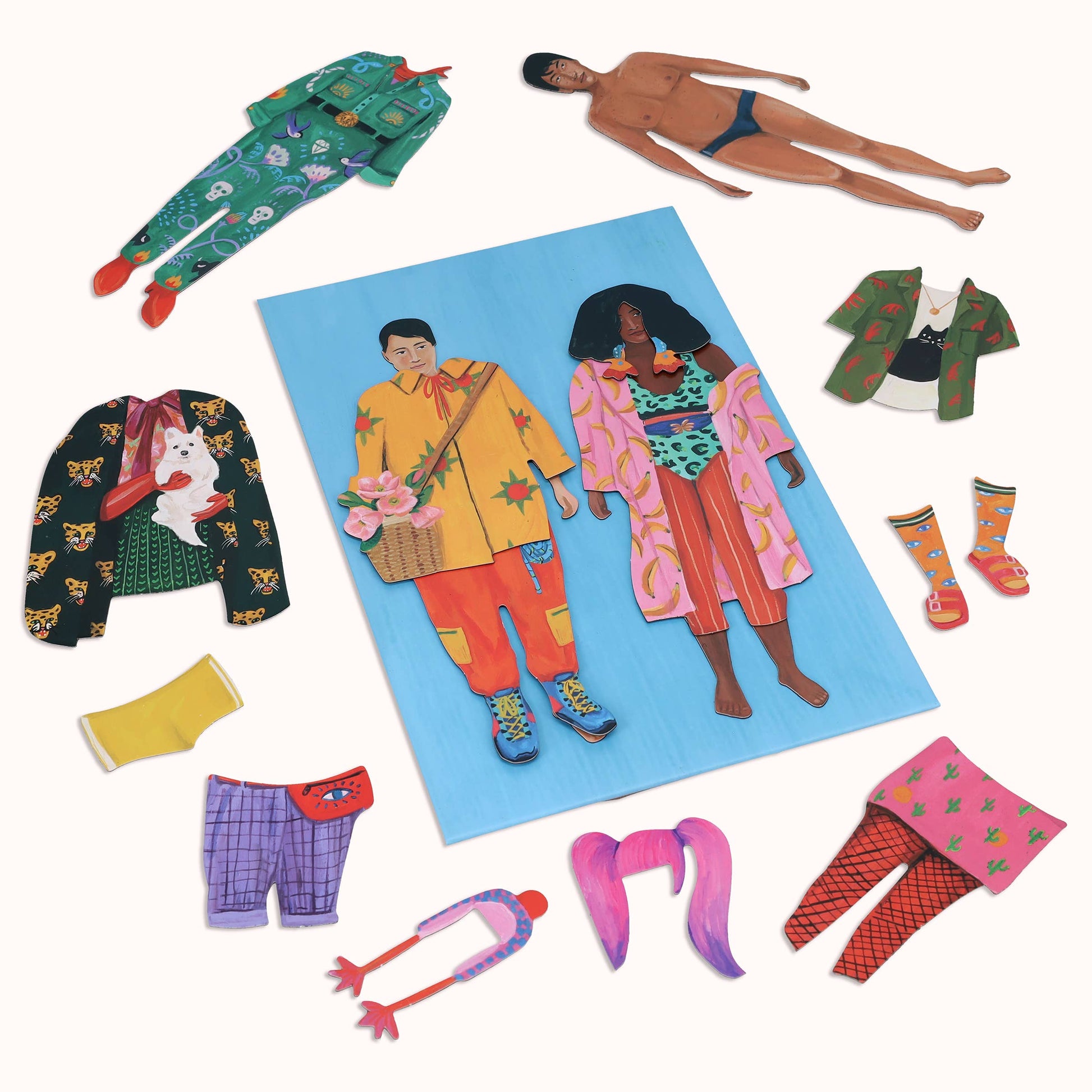 Colorful magnetic dolls with vibrant and colorful clothing on a white background