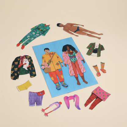 Colorful magnetic dolls with vibrant and colorful clothing on a white background