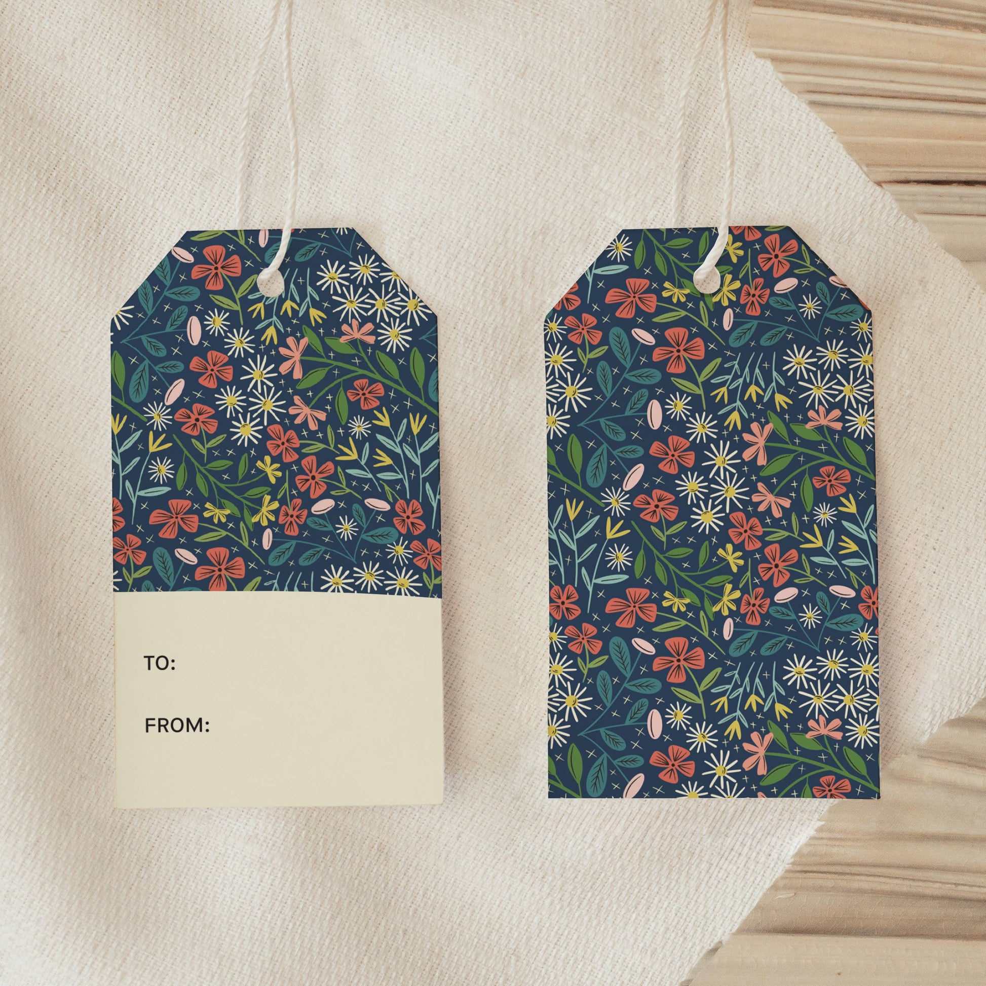 Set of 8 Overflow Garden gift tags with navy floral print and included twine