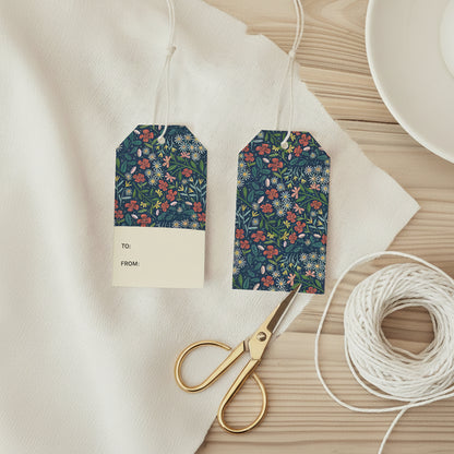 Two floral gift tags on a textured beige background