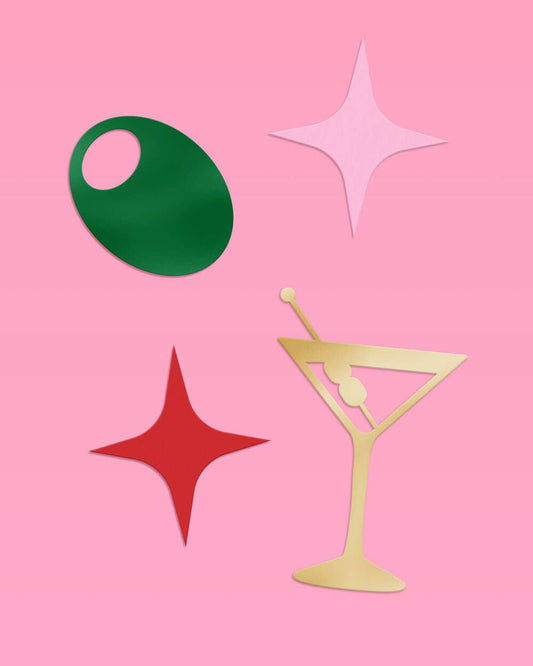 Martini Moment confetti with gold martini glasses, green olives, and pink and red foil sparkles for party celebrations