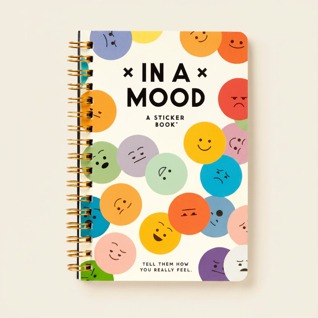 Sticker book with colorful emoji-style faces on a white background