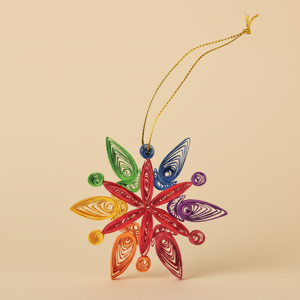 Colorful paper snowflake ornament on a white background