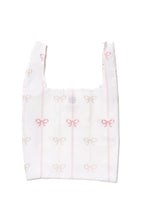 Vivi Daily Shopper from BRNG Bag unfolded with pink bows and a white background.