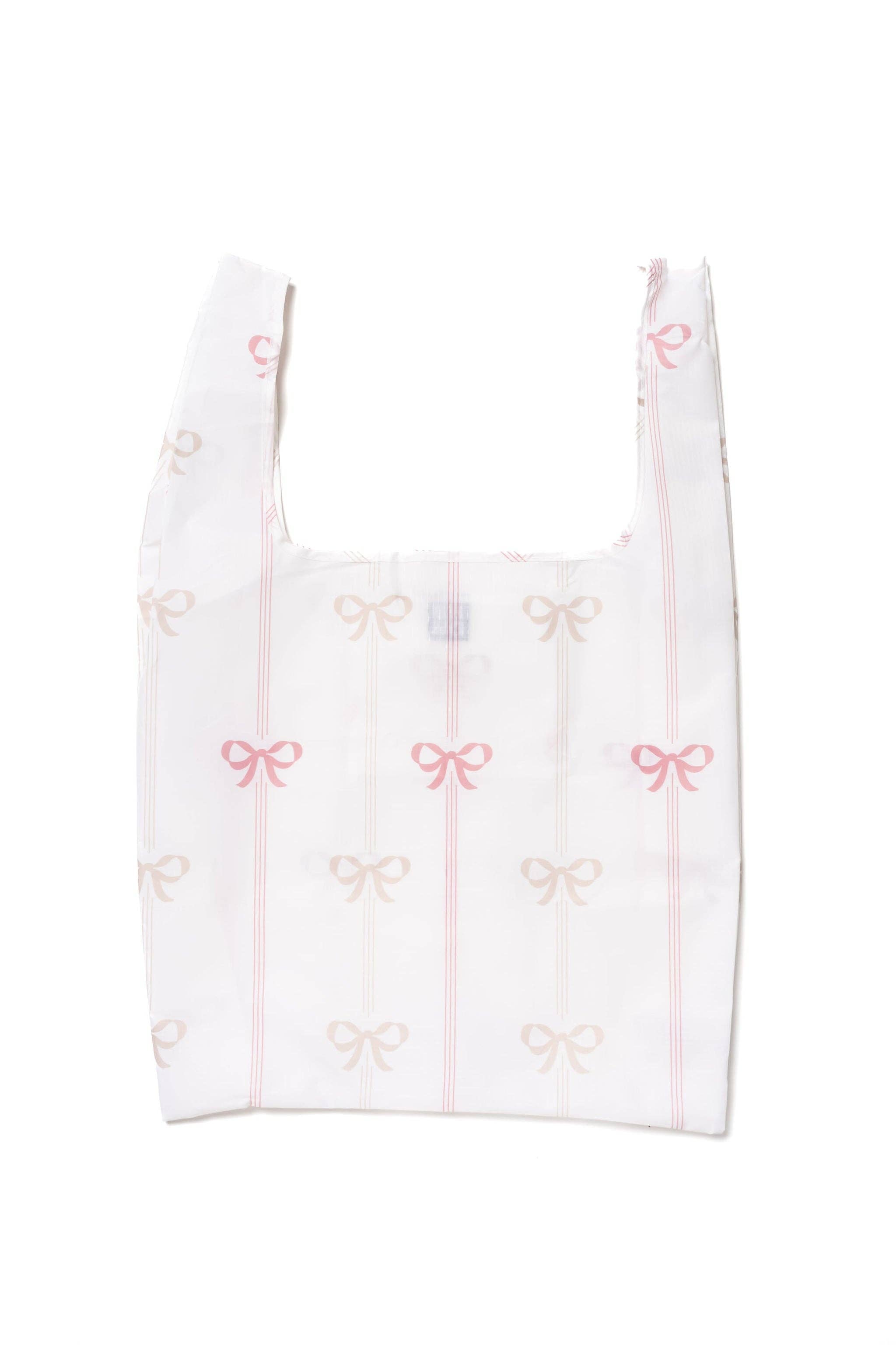 Vivi Daily Shopper from BRNG Bag unfolded with pink bows and a white background.
