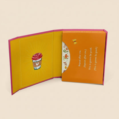 Open book with yellow interior and orange cover on a white background