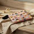 The medium Handmade Floral Pouch with Tulips on Pink Embroidered Coin Purse flat lay on a wooden desk with neutral background and natural accessories. 