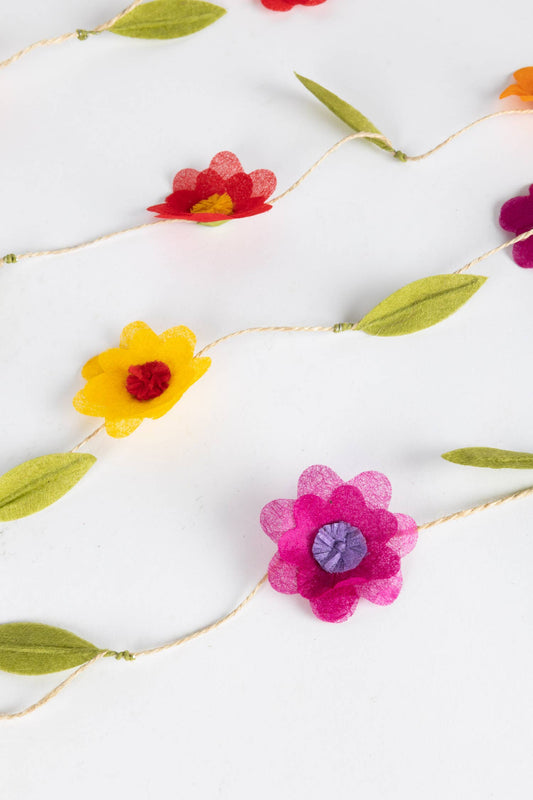 Close-up of silk paper flowers with moldable leaves on a 12-foot twine garland