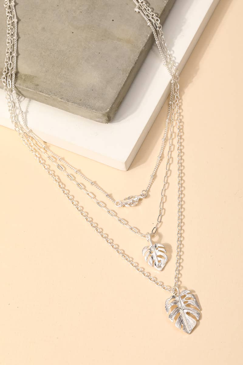 Layered monstera leaf charm necklace in white gold