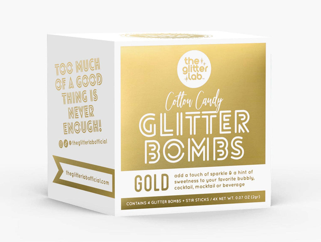Box of Gold Glitter Bombs with pouches and stir sticks, ready for a sparkling drink experience.