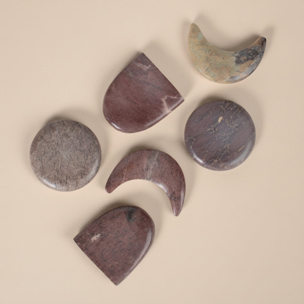 Set of stone-shaped coasters on a white background