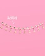 Martini banner with gold foil martini glasses, green olives, and pink tissue accents | 3D paper garland for parties