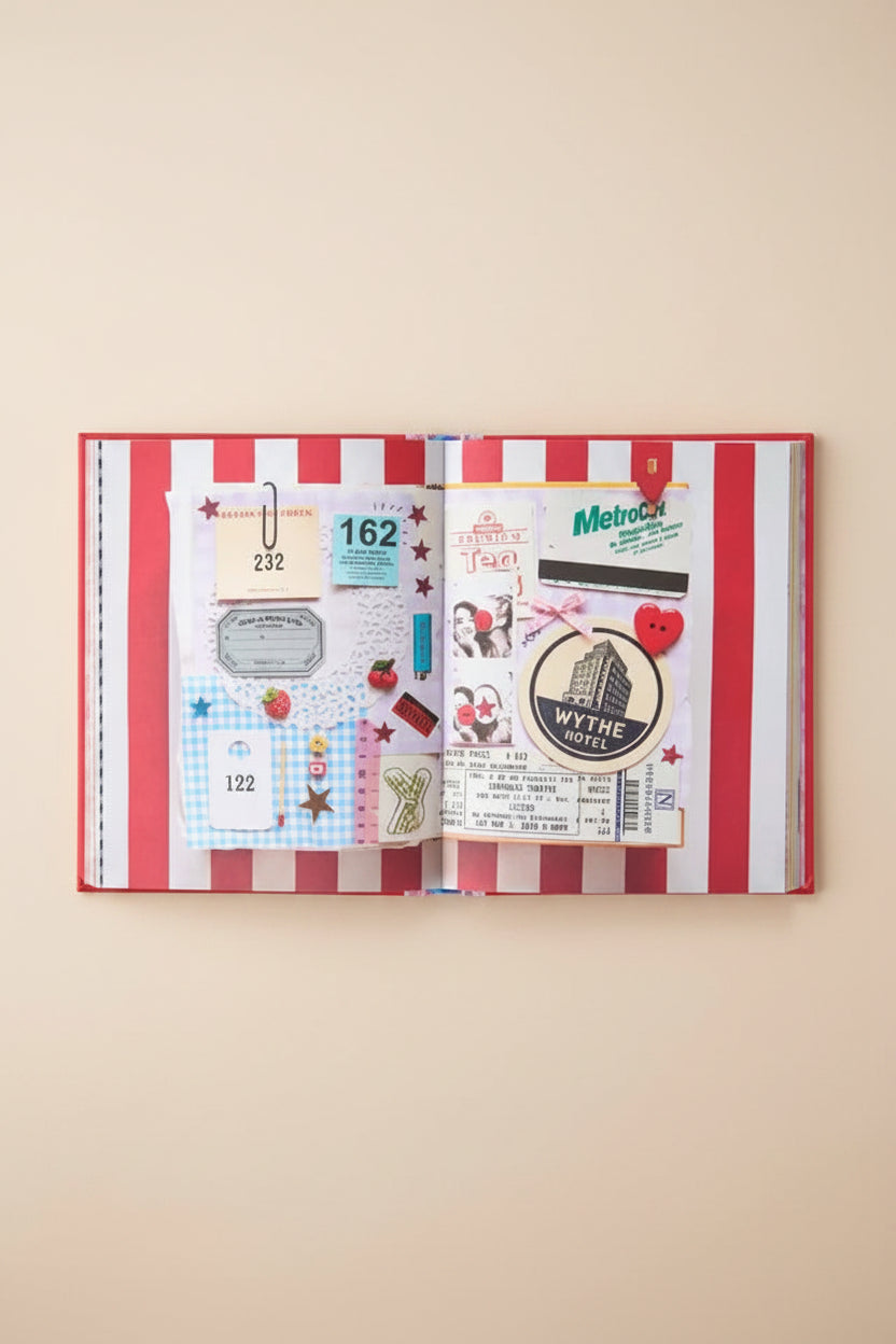 Open notebook with stickers on a white background