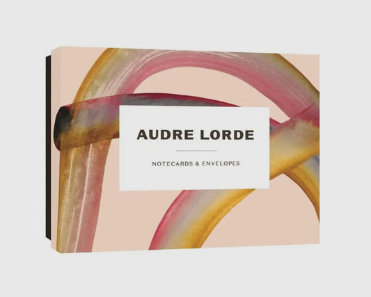 Audre Lorde notecards and envelopes fanned out to show quotes and vibrant designs