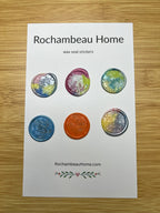 Close up view of the Autism Awareness wax seal stickers on a 6 pack card