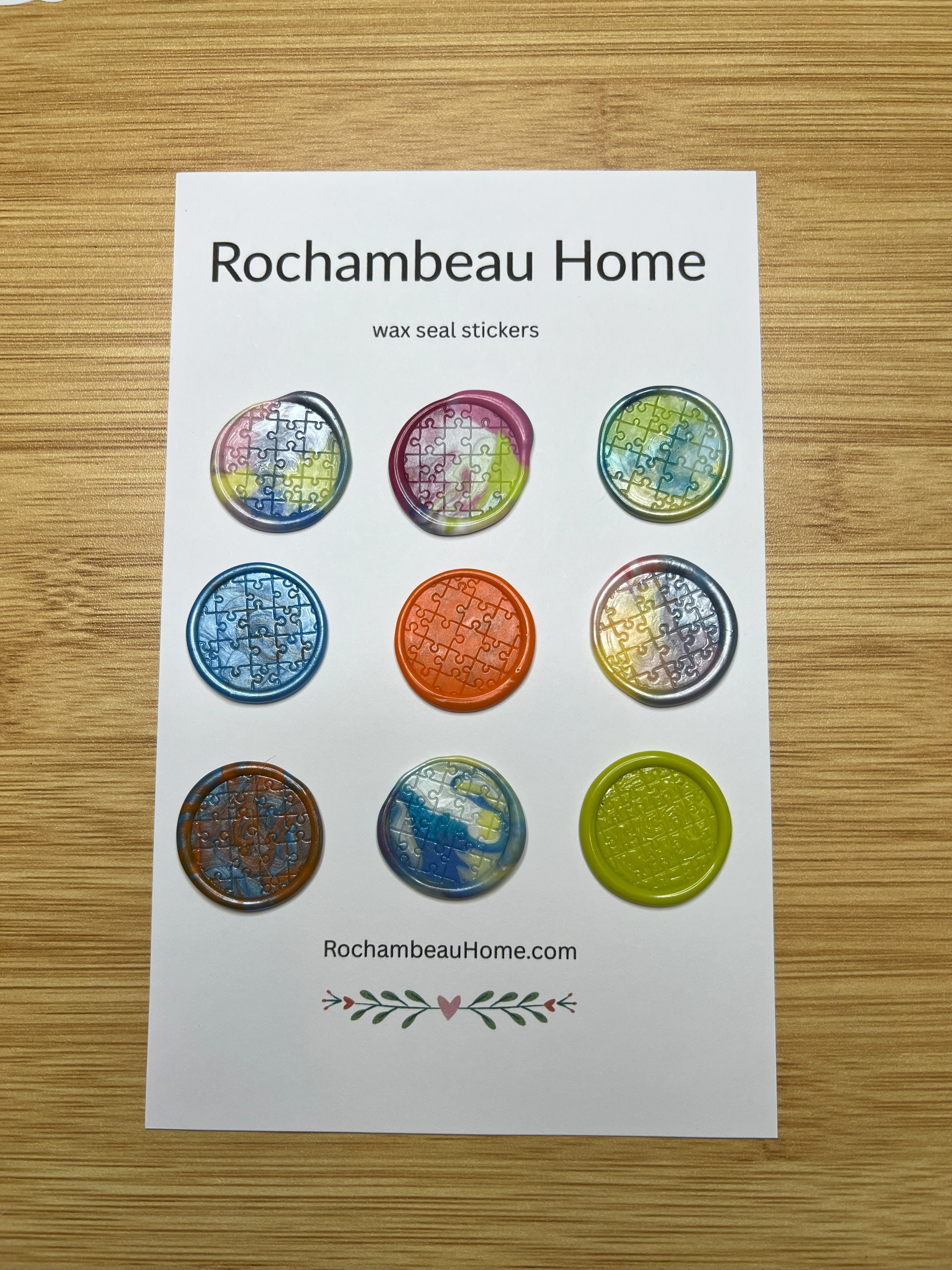 Close up view of the Autism Awareness wax seal stickers on a 9 pack card